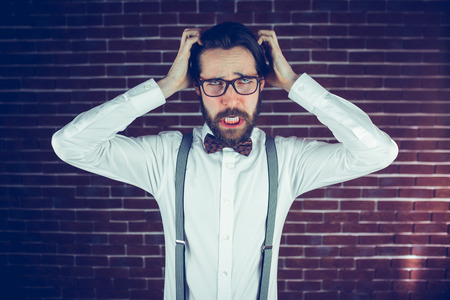 Angry Man with Head in Hands