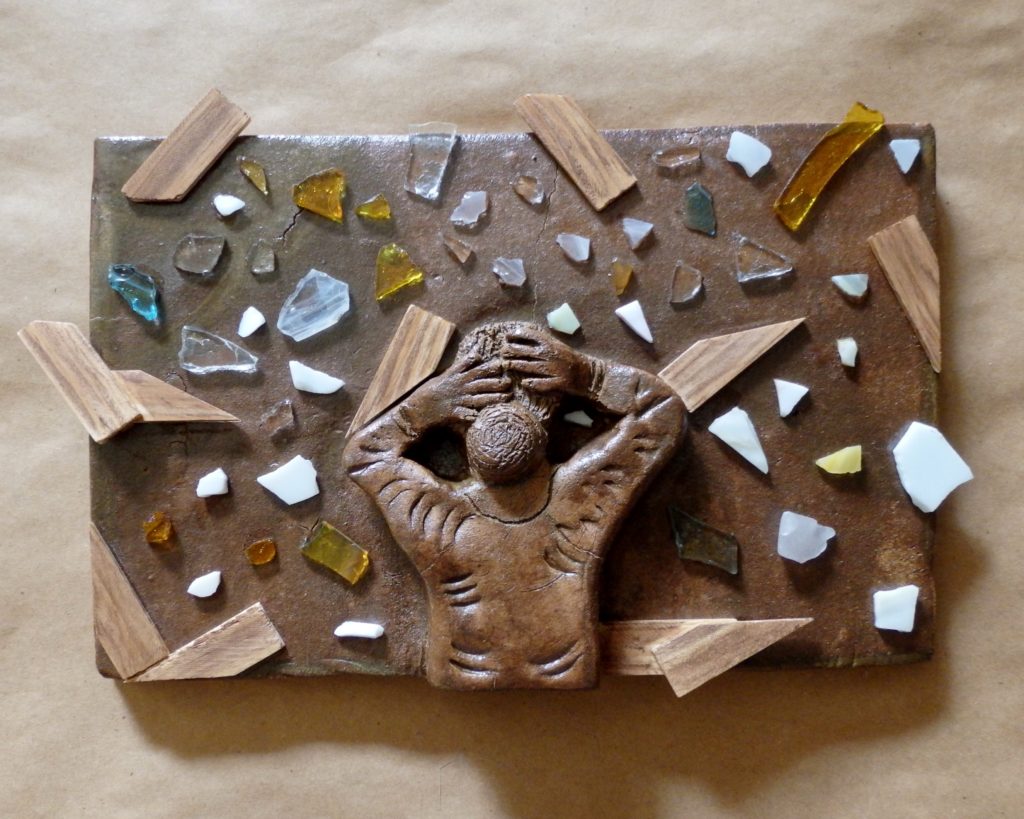 Sculpture of Woman with Hands on Head