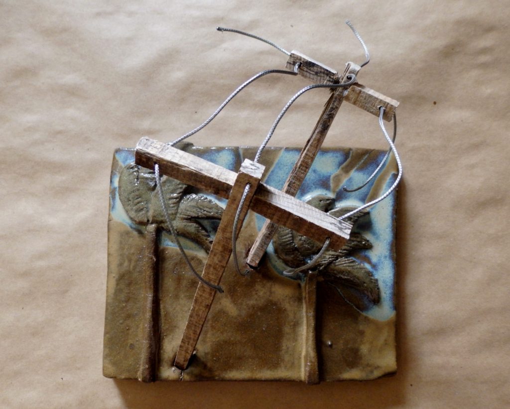 Clay Sculpture of Palm Trees and Power Lines in Wind